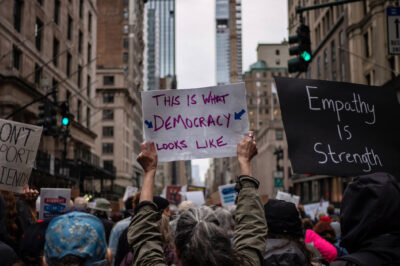 A group of demonstrators in Manhattan holding pro-democracy signage.