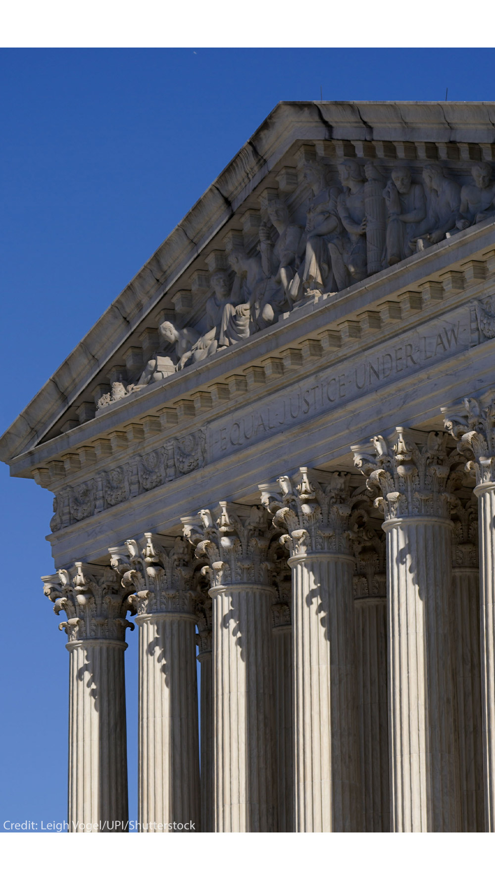 A half-lowered US flag waves in front of the US Supreme Court.