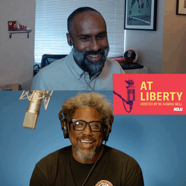 Picture of podcast host W. Kamau Bell interviewing a guest